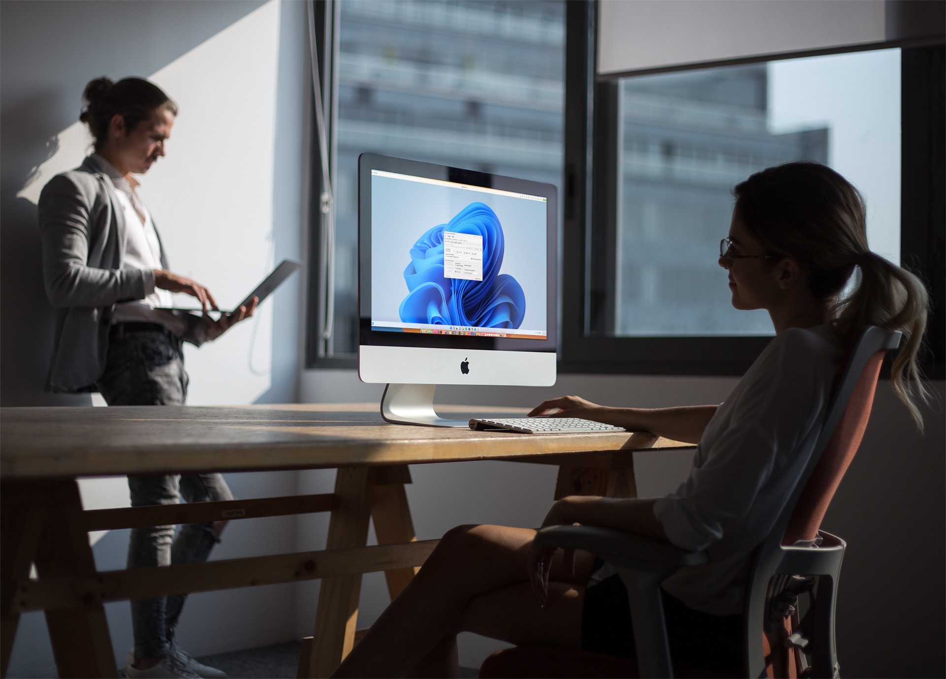 People working with Windows applications in an office